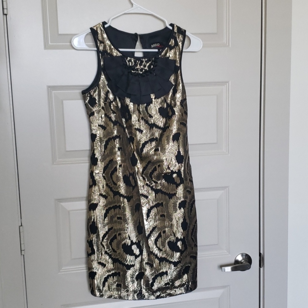 Stunning black/gold dress with chest detail